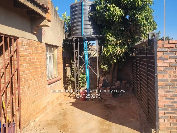 A neat 7-roomed, 4-bedroom house sitting on 200m², ideal for a family or as an investment property.
