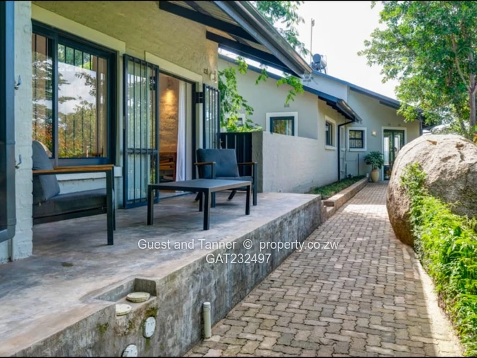 Luxury Safari-Style 4-Bedroom House with Cottage, Pool, Borehole, and Smart Home Features for Sale