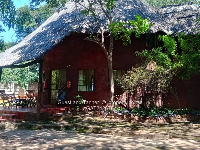 Ten bedroomed lodge under thatch for sale 