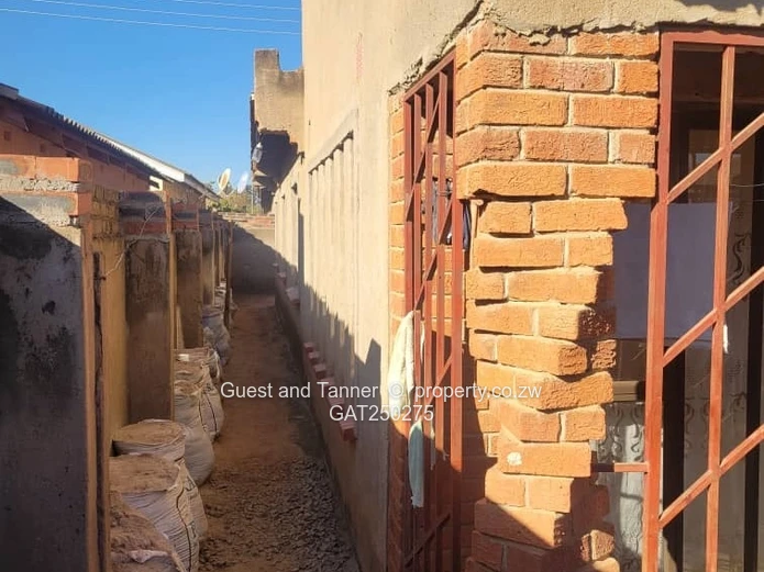 A neat 7-roomed, 4-bedroom house sitting on 200m², ideal for a family or as an investment property.